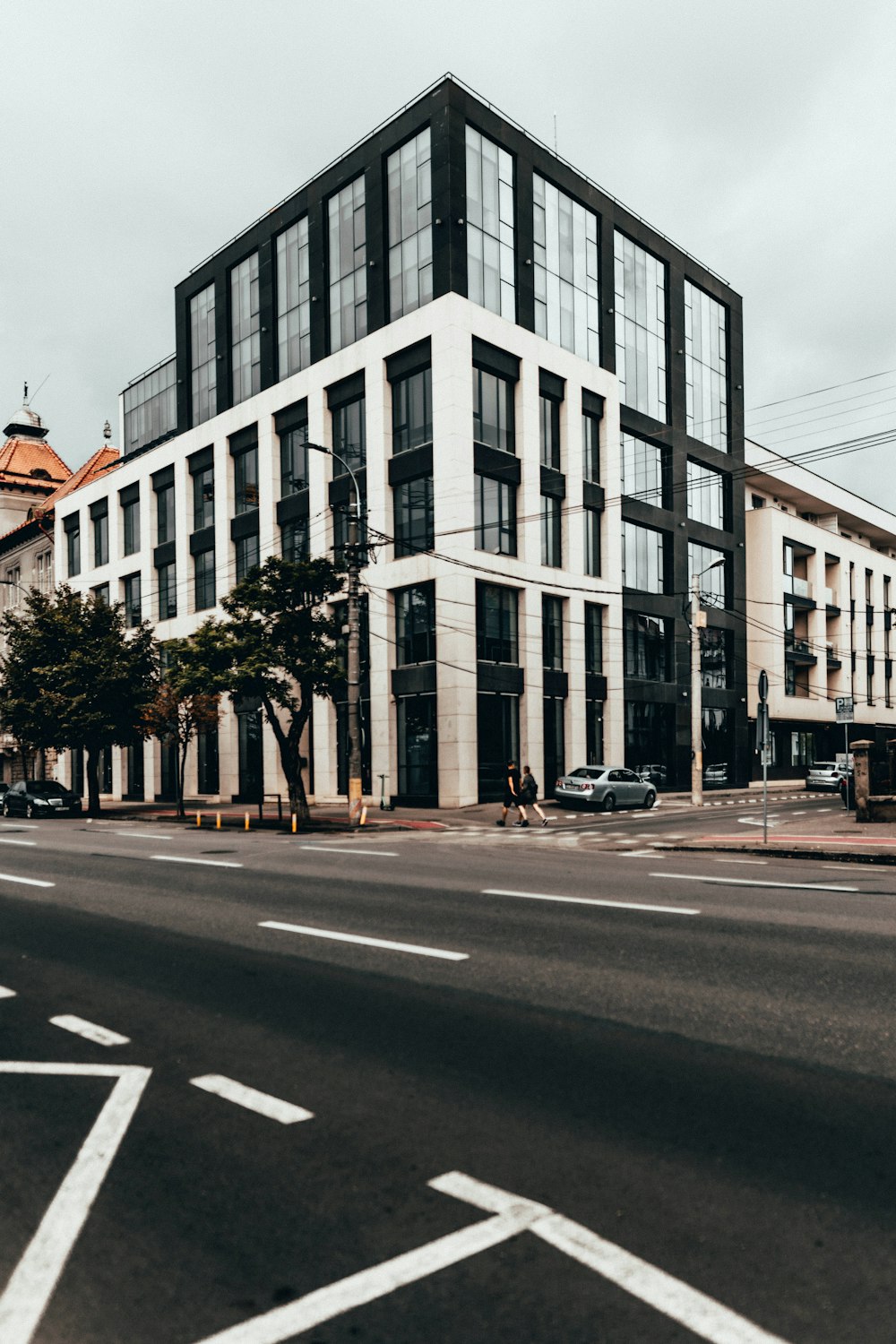 cars parked in front of building during daytime