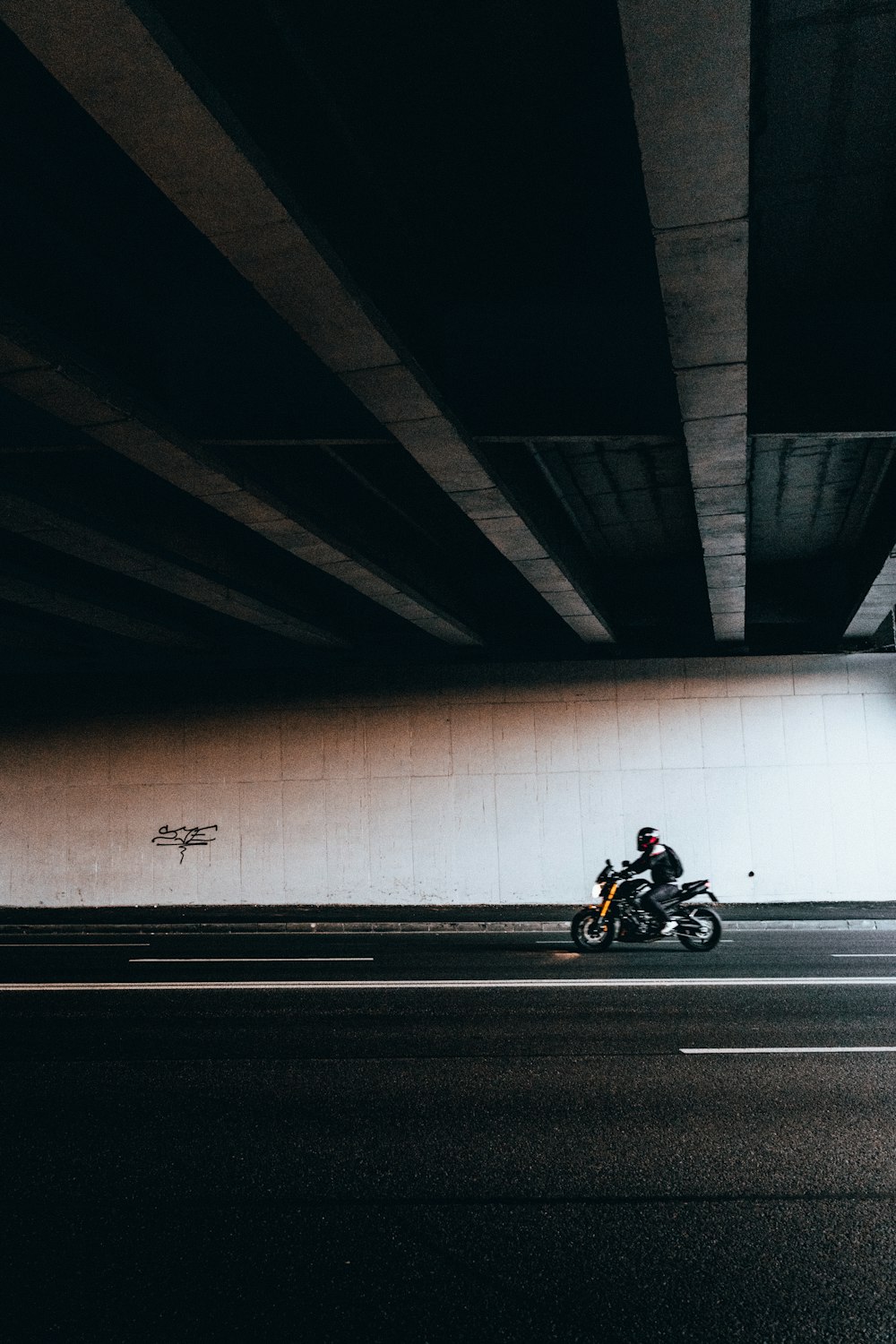 man in black jacket riding motorcycle