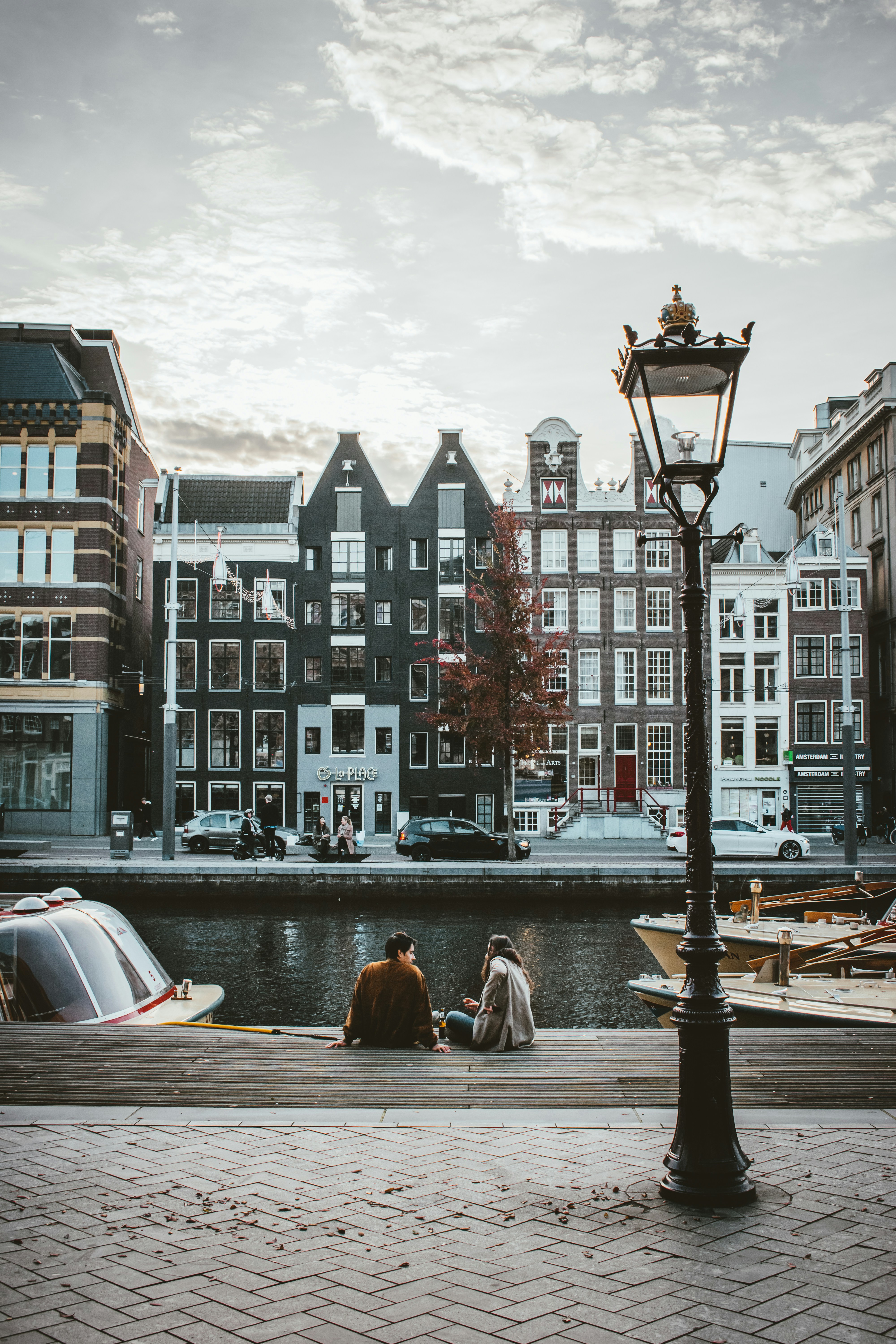 Sunday chill on the "Oude Turfmarkt" in Amsterdam, overlooking the canal and coloured and crooked houses.