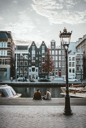 people walking, biking in Amsterdam and buildings in Amsterdam
