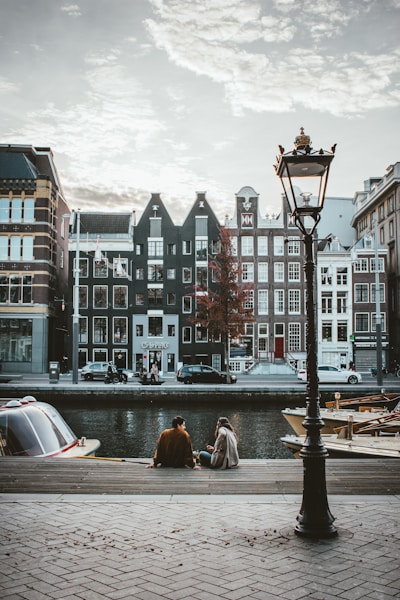 people walking, biking in Amsterdam and buildings in Amsterdam