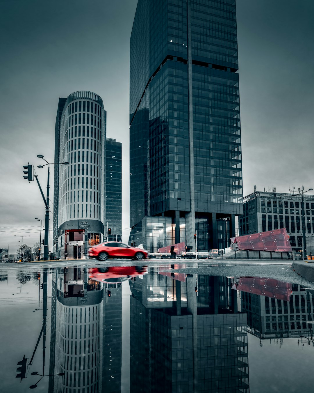 red and white boat on water near high rise buildings during daytime