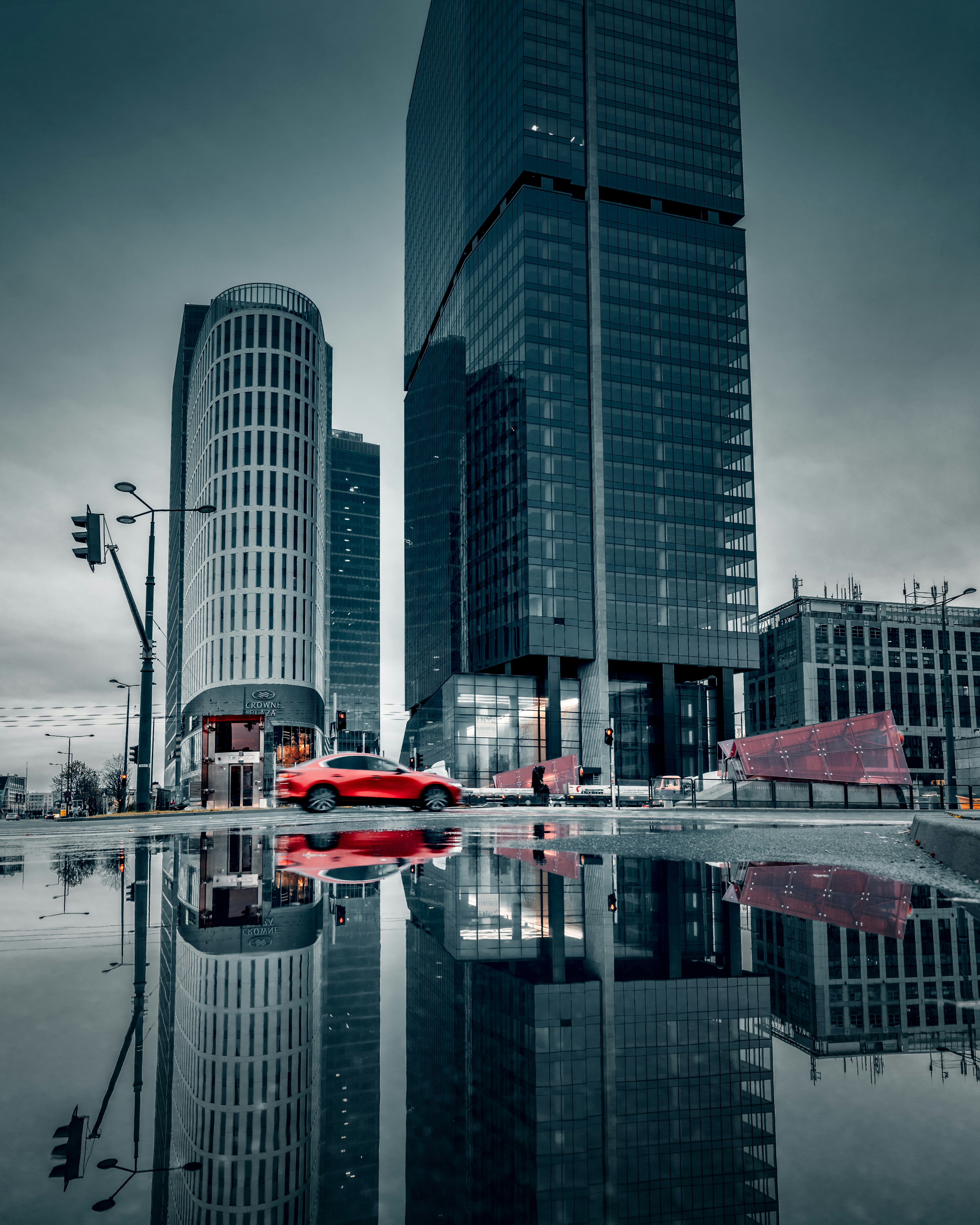 red and white boat on water near high rise buildings during daytime