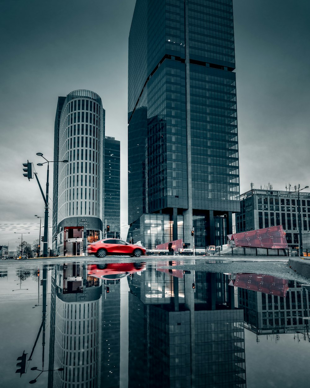 red and white boat on water near high rise buildings during daytime