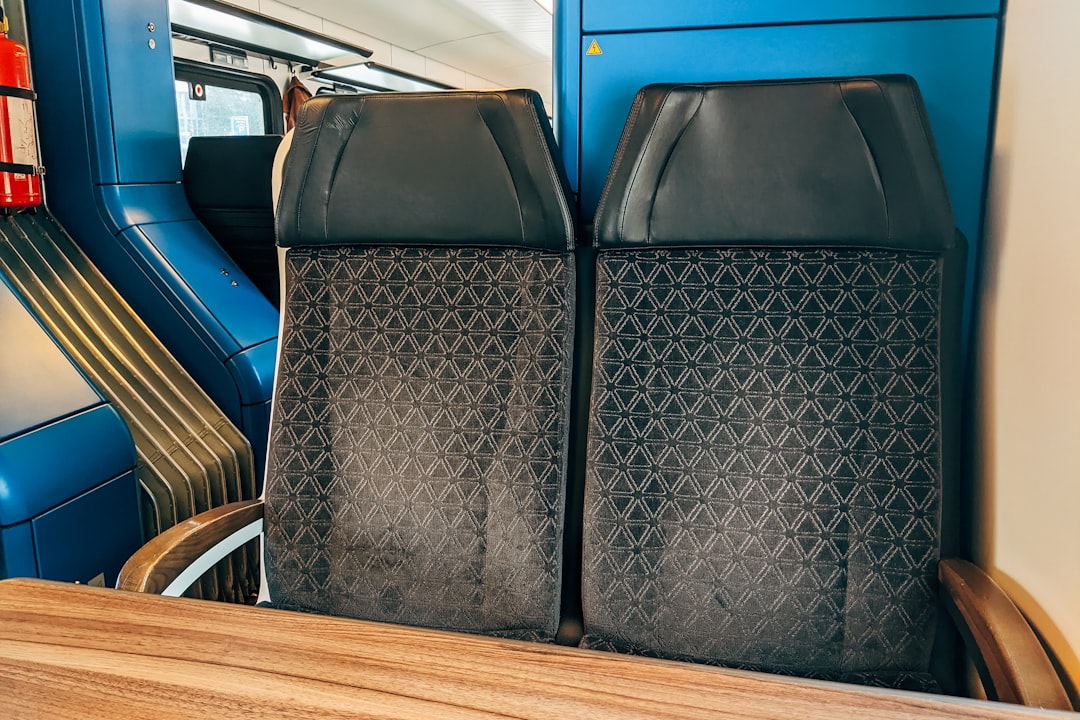 black leather chair on brown wooden floor