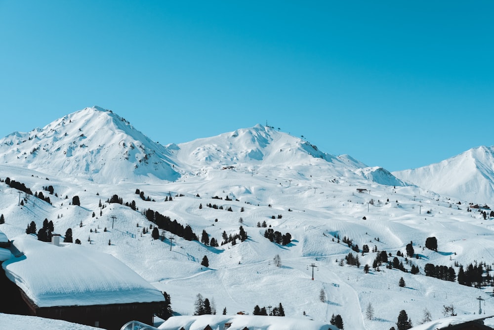 snow covered mountain under blue sky during daytime