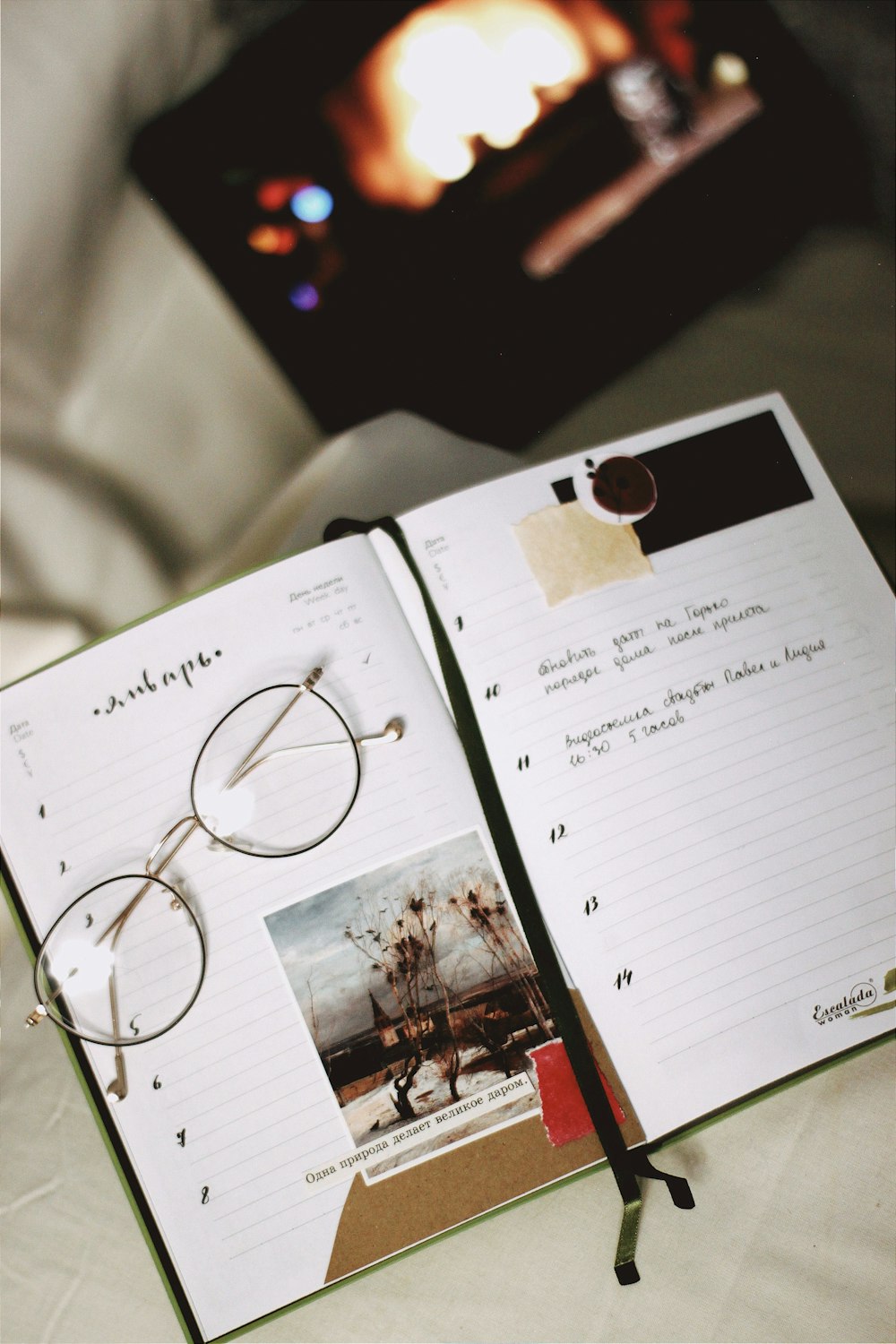 silver framed eyeglasses on book page