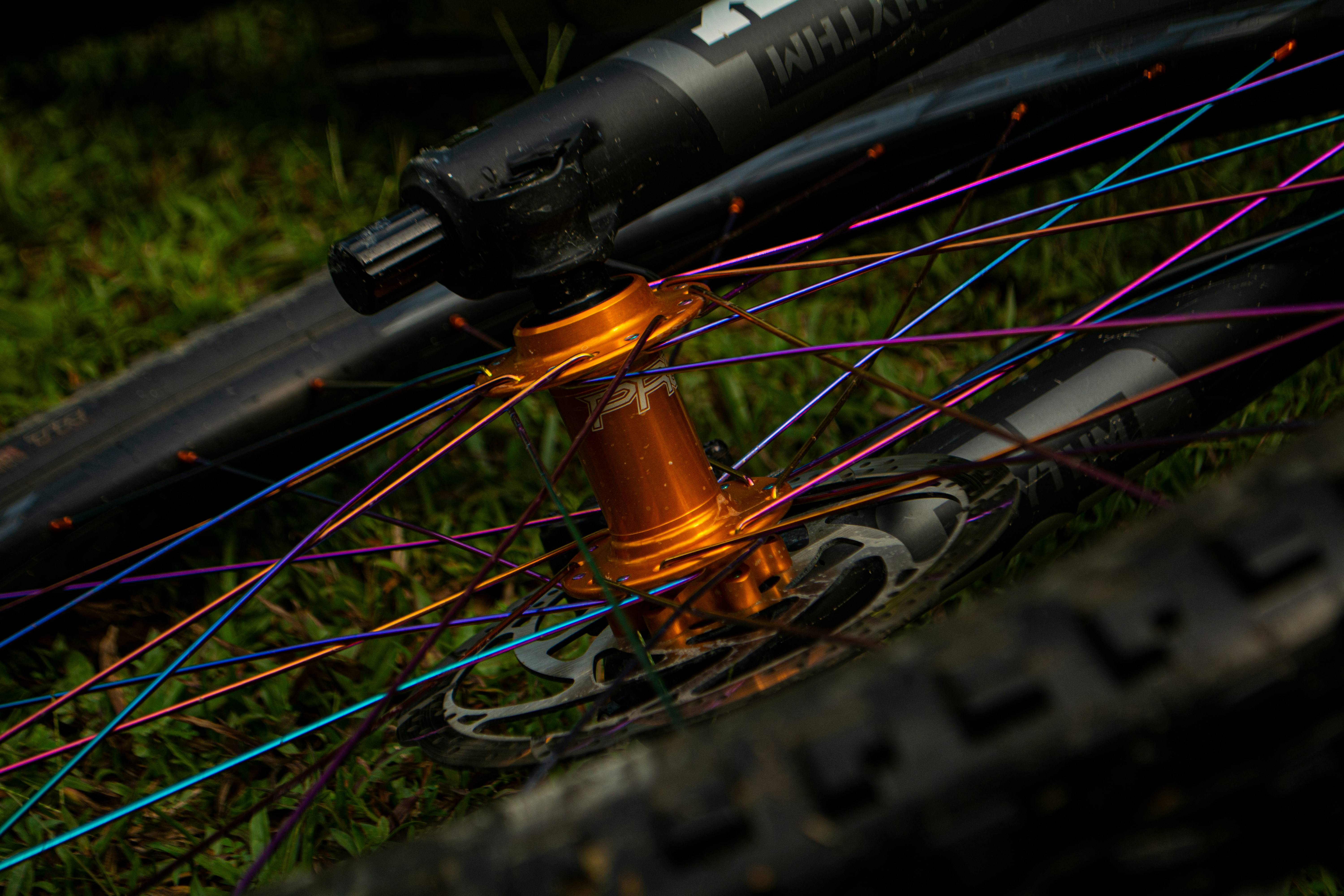 black and orange bicycle wheel