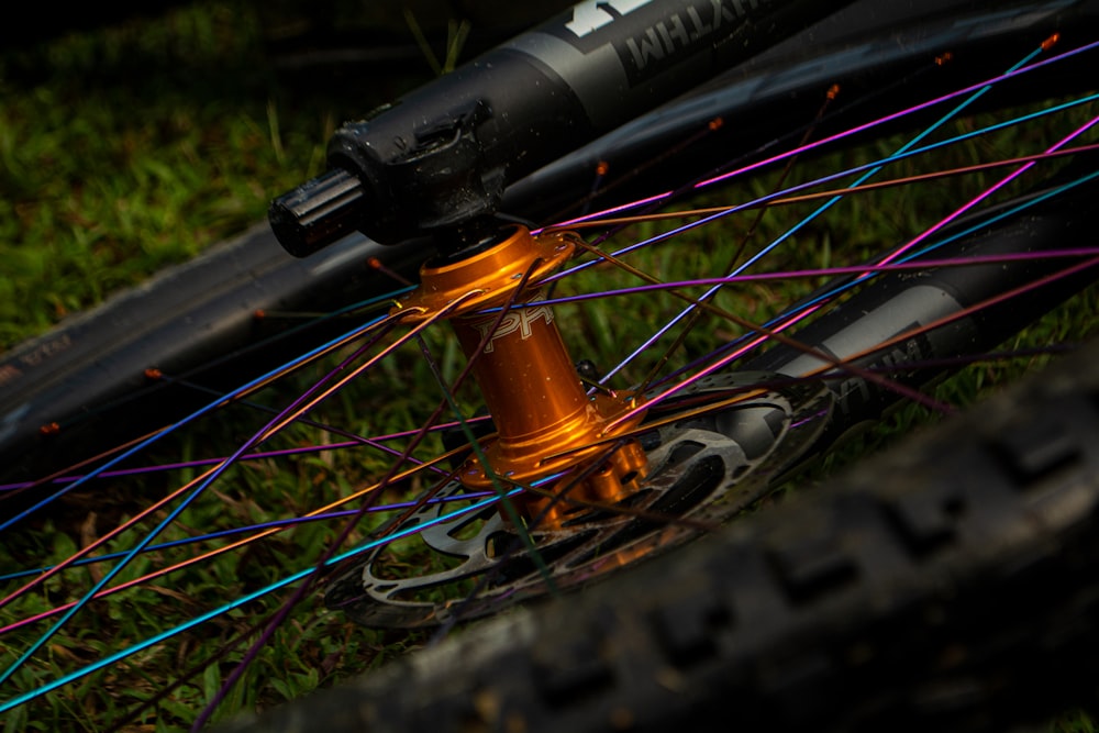 black and orange bicycle wheel