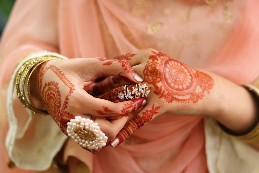 person wearing silver and black ring