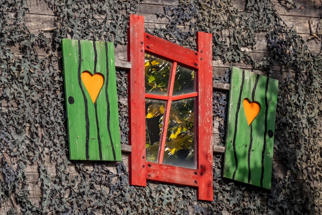 brown wooden frame with green and yellow heart print