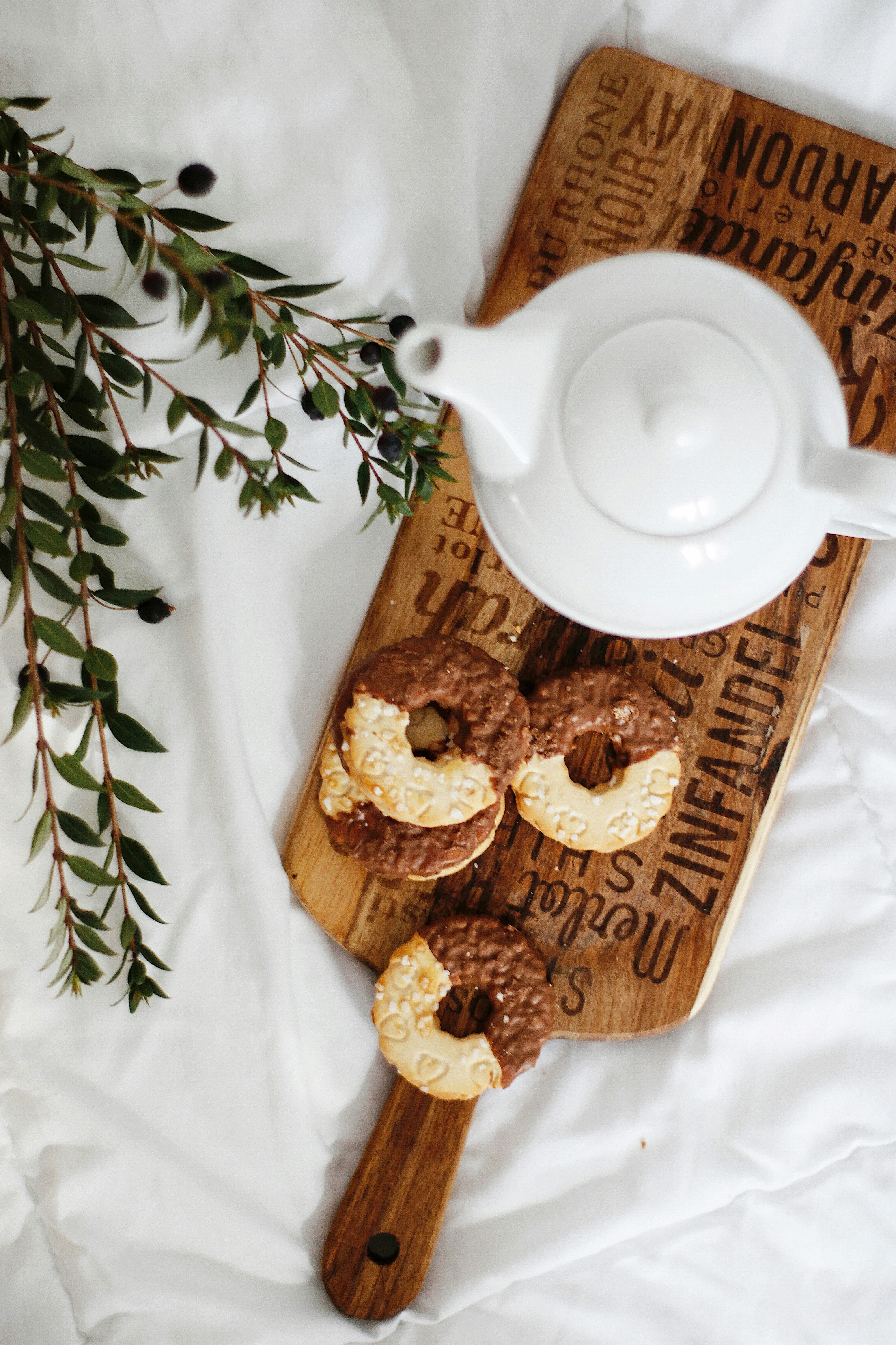 white-ceramic-teapot-on-brown-wooden-tray
