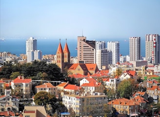 city buildings under blue sky during daytime