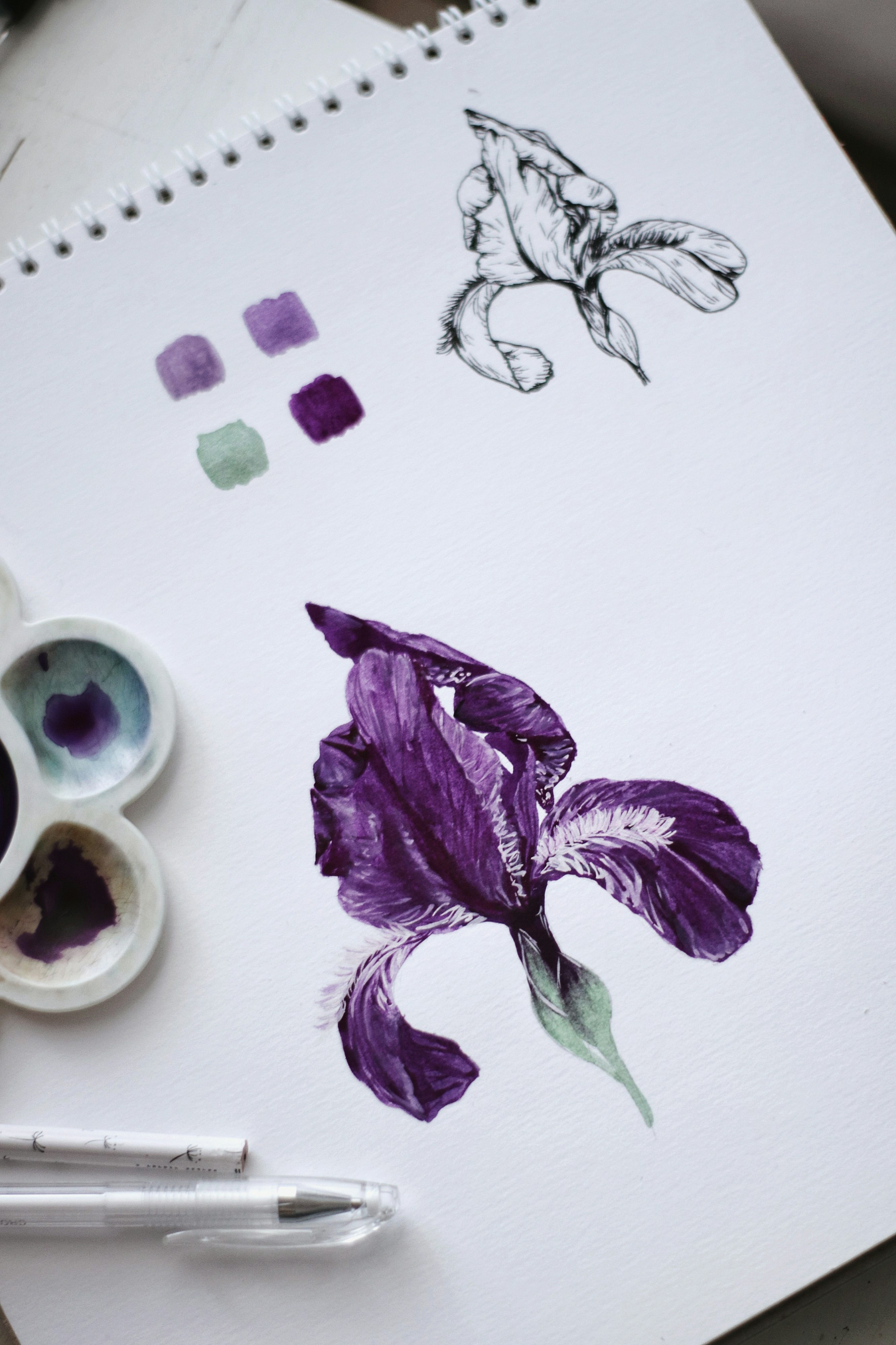 purple flower beside white ceramic mug with coffee