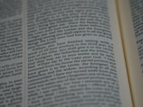 An open book with tightly spaced text filling the pages. The focus is on a section discussing religious or spiritual content, possibly from a sacred or historical text.