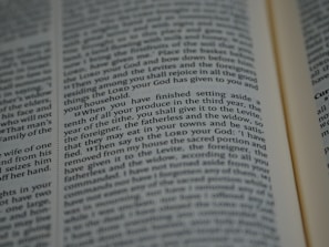 An open book with tightly spaced text filling the pages. The focus is on a section discussing religious or spiritual content, possibly from a sacred or historical text.