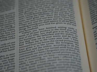 An open book with tightly spaced text filling the pages. The focus is on a section discussing religious or spiritual content, possibly from a sacred or historical text.