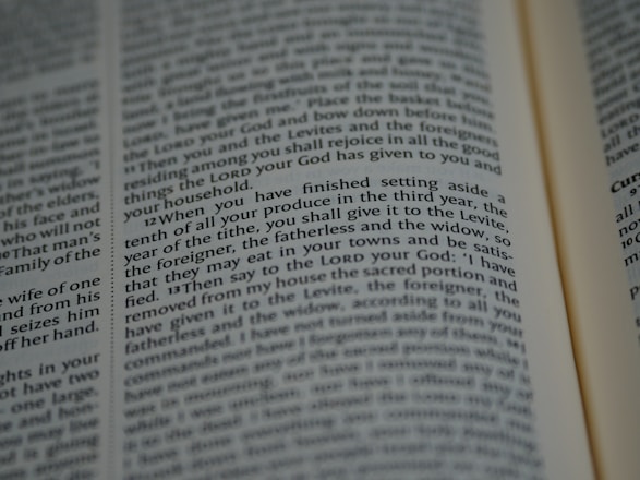 An open book with tightly spaced text filling the pages. The focus is on a section discussing religious or spiritual content, possibly from a sacred or historical text.