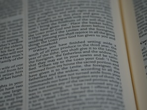 An open book with tightly spaced text filling the pages. The focus is on a section discussing religious or spiritual content, possibly from a sacred or historical text.