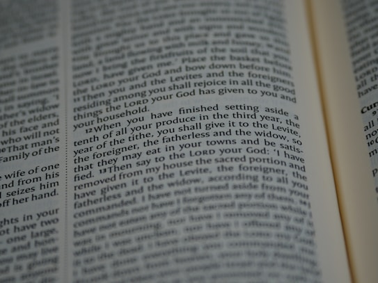 An open book with tightly spaced text filling the pages. The focus is on a section discussing religious or spiritual content, possibly from a sacred or historical text.