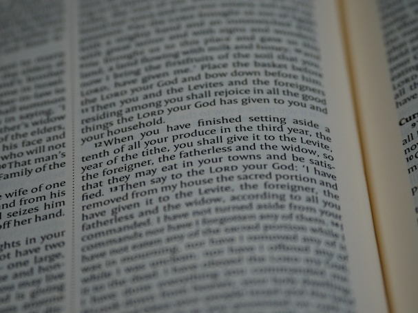 An open book with tightly spaced text filling the pages. The focus is on a section discussing religious or spiritual content, possibly from a sacred or historical text.