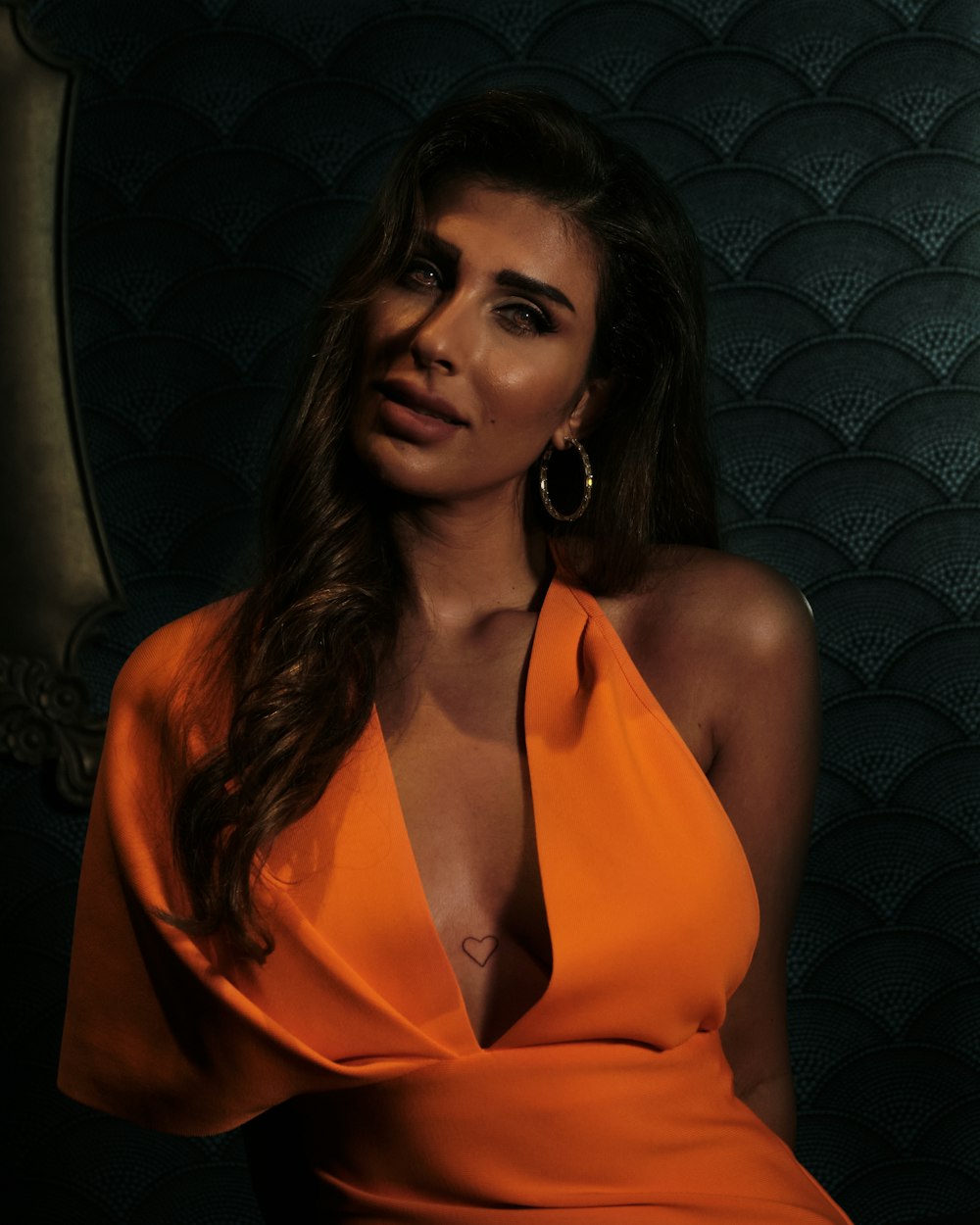 woman in orange halter top