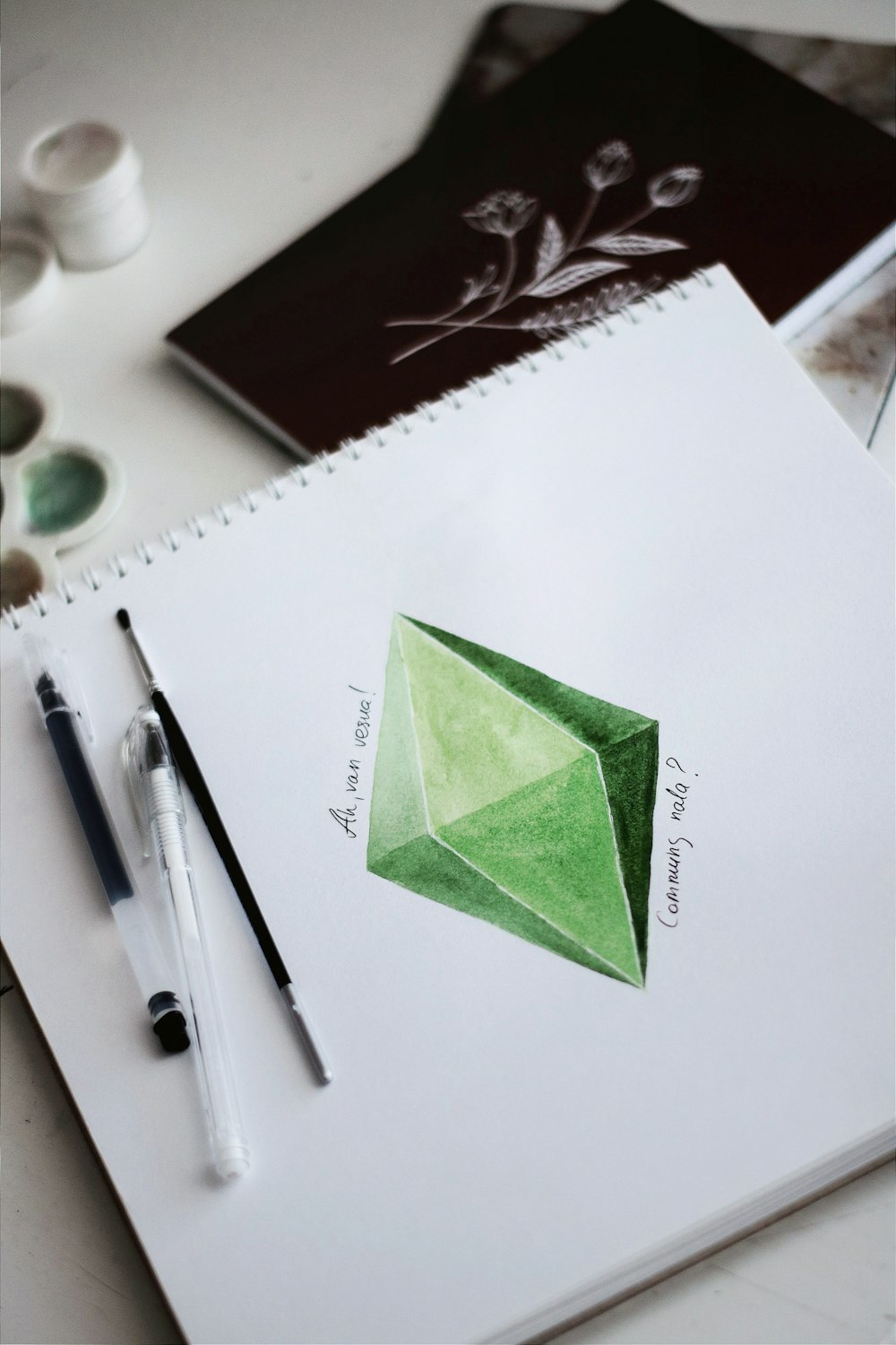 green sticky note on white paper