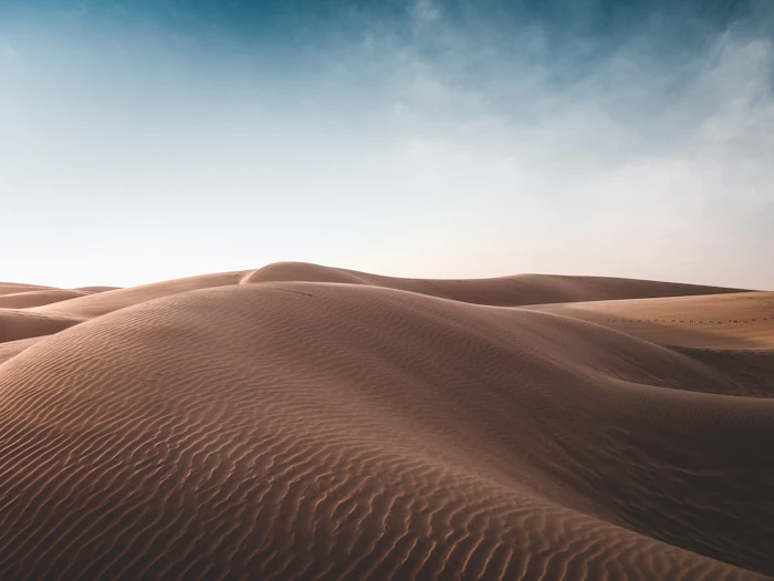 Sand dunes under a blue sky