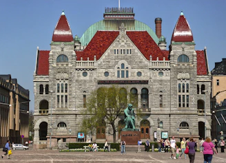 Outdoor view of the historic building with students walking through the central city streets of Salta