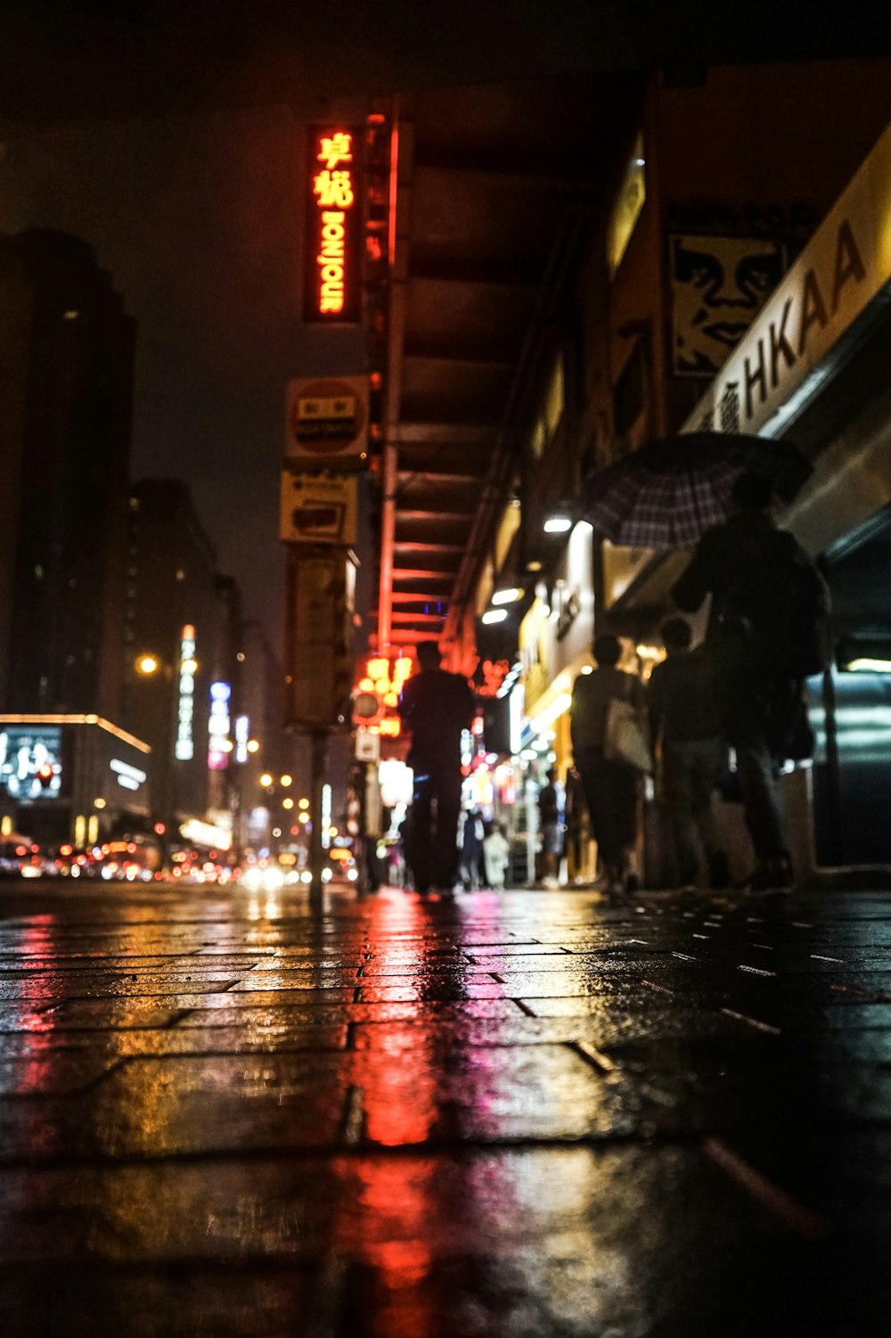 people walking on street during night time