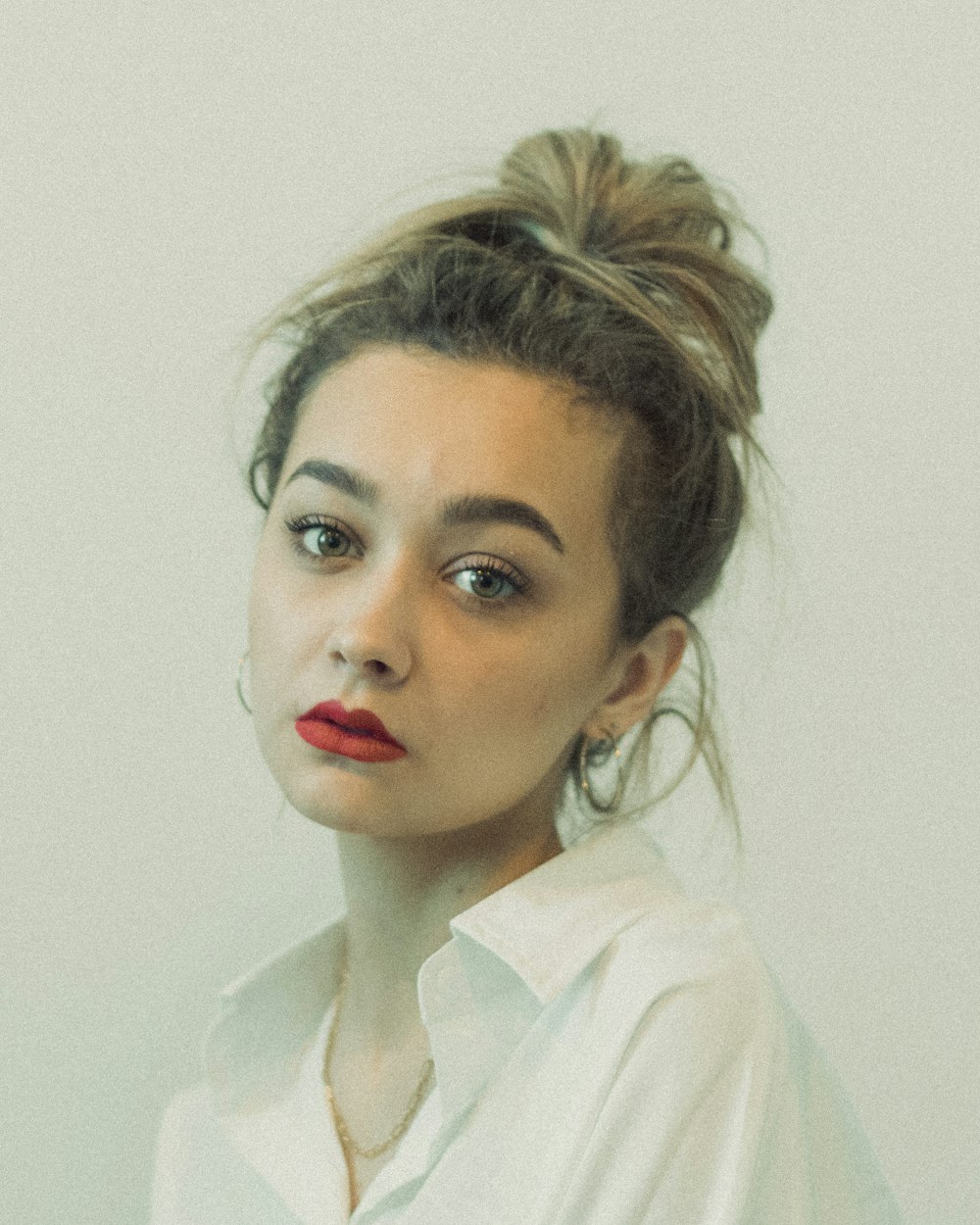 woman in white collared shirt