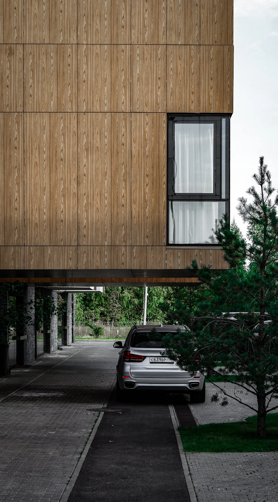 Exterior wall with vertical siding boards in even rhythm