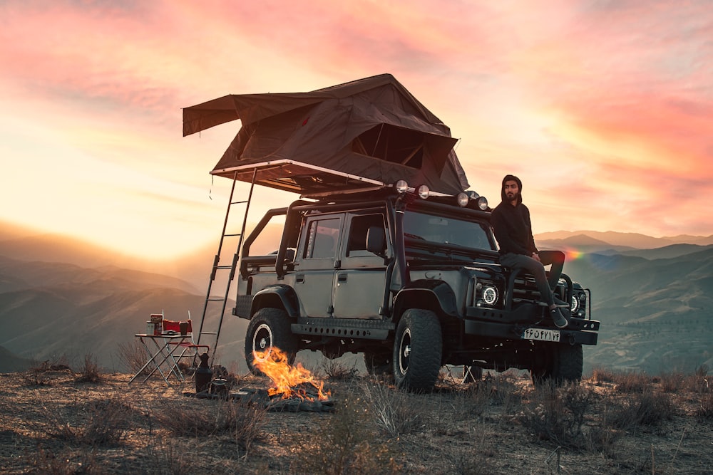 black jeep wrangler on brown field during sunset