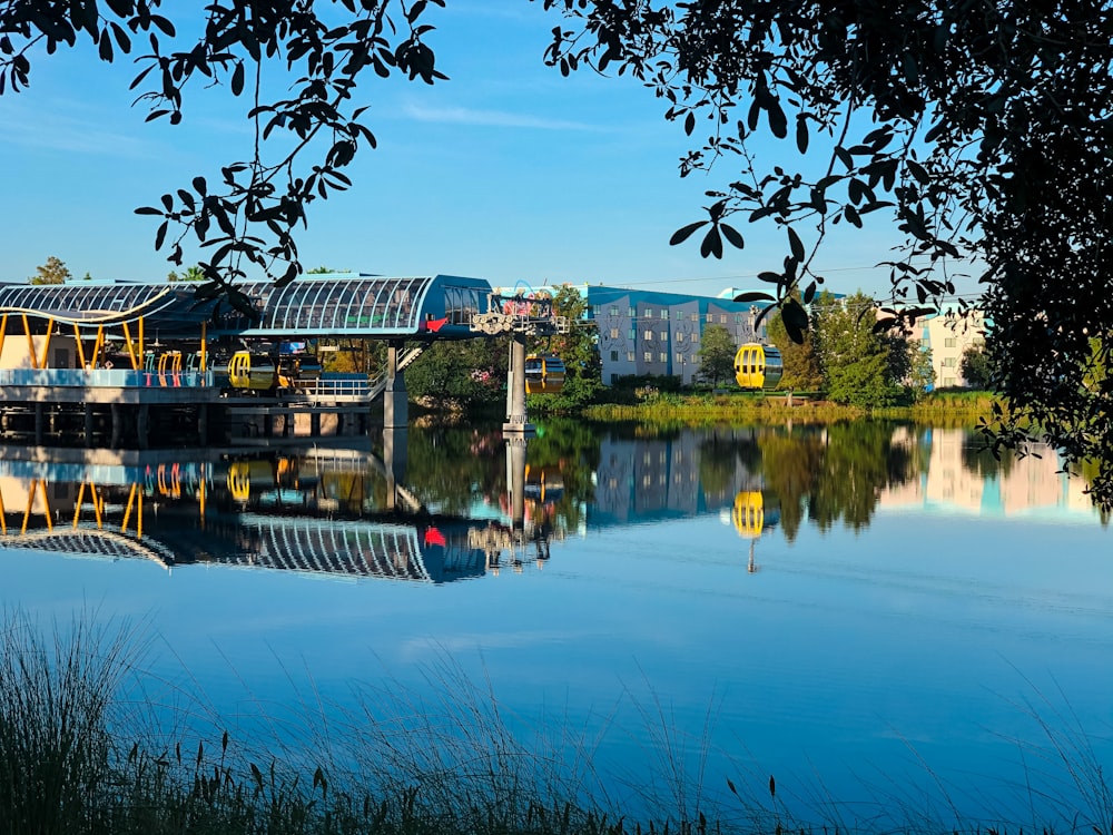 body of water near green trees and buildings during daytime