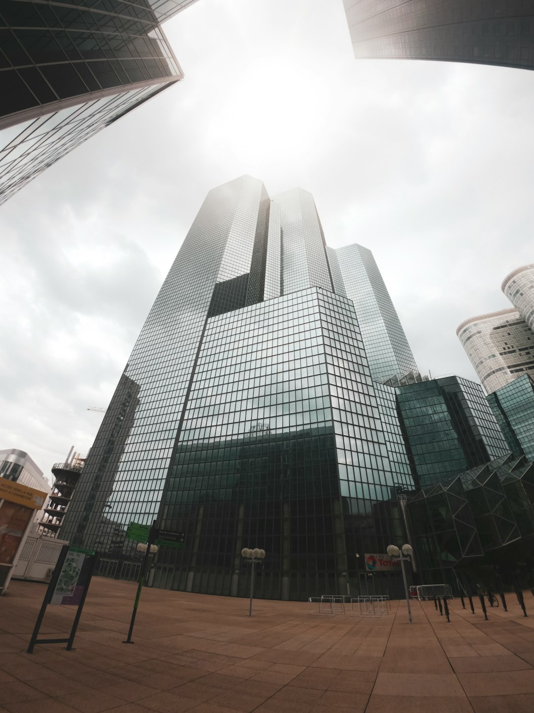 gray concrete building under white clouds during daytime