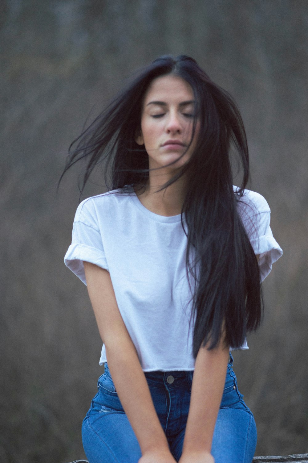 woman in white crew neck t-shirt and blue denim shorts