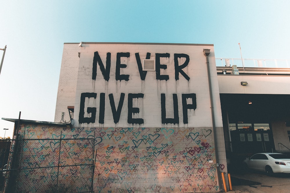 a building with graffiti written on the side of it