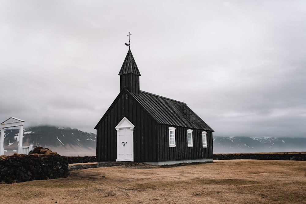 gray and black church under gray clouds