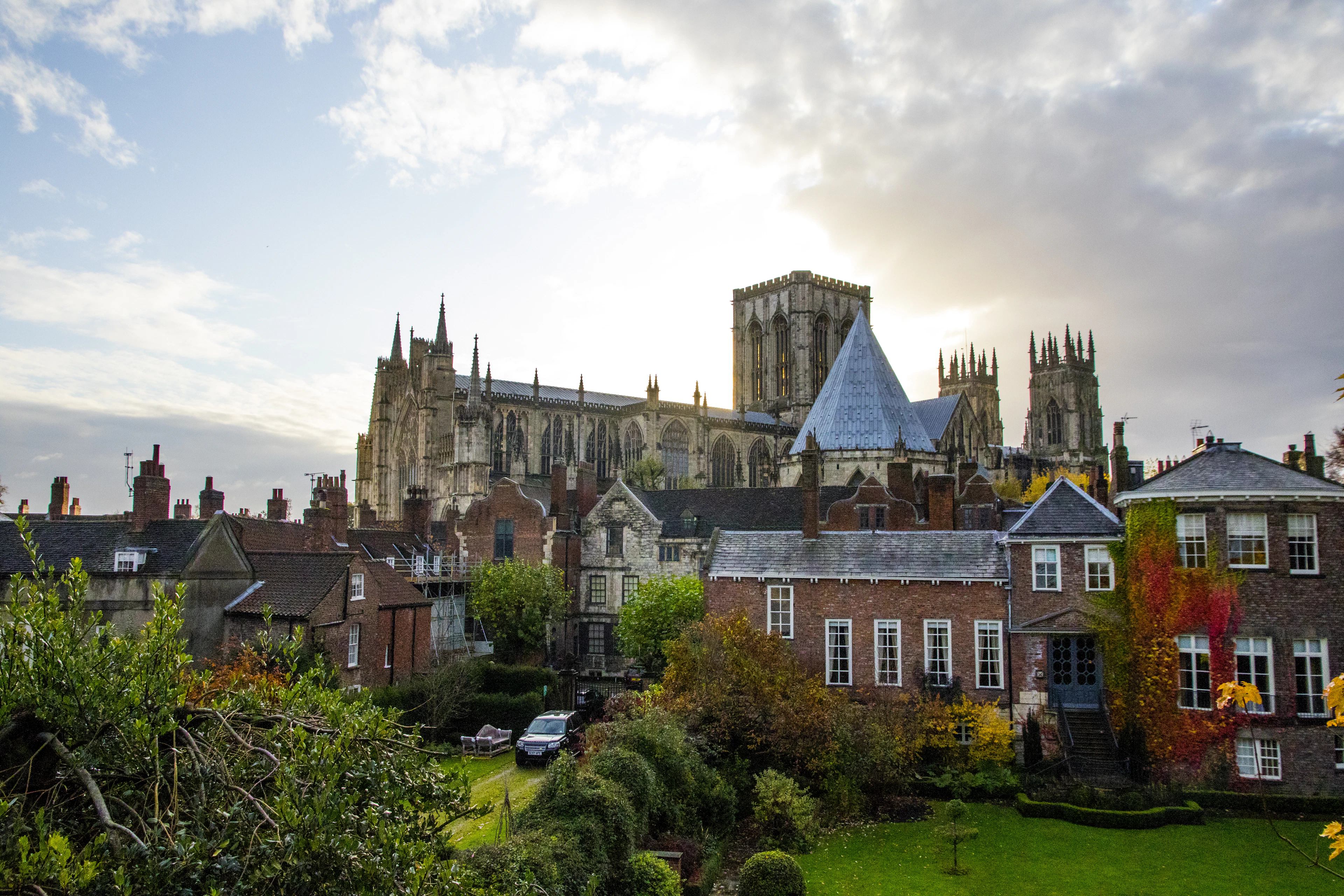 York Minster rising above the roofs and gardens of the old city in autumn