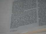 A close-up image of a page from a book, showing text in a serif font with uniform spacing and alignment. The text appears to be in English and covers multiple lines on both pages.