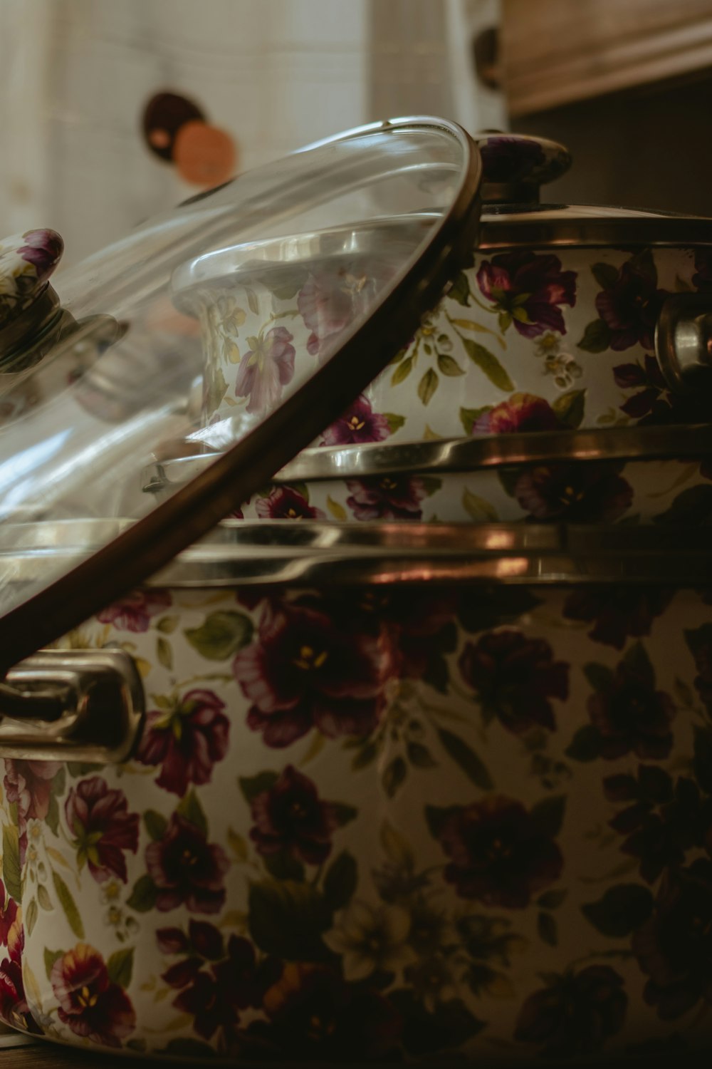 a close up of a pot with flowers on it