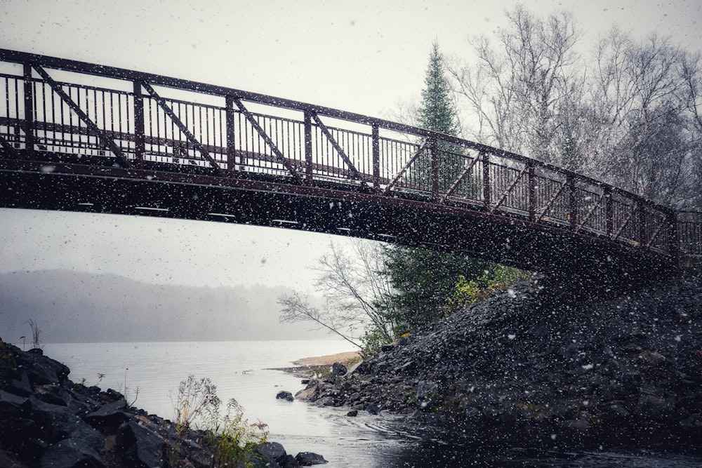 black metal bridge over river