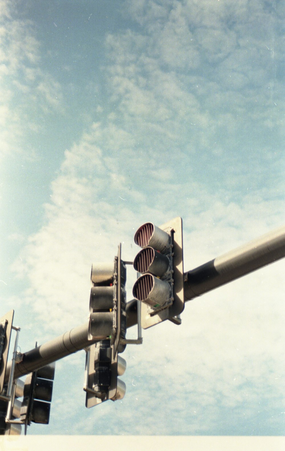 black traffic light under blue sky during daytime