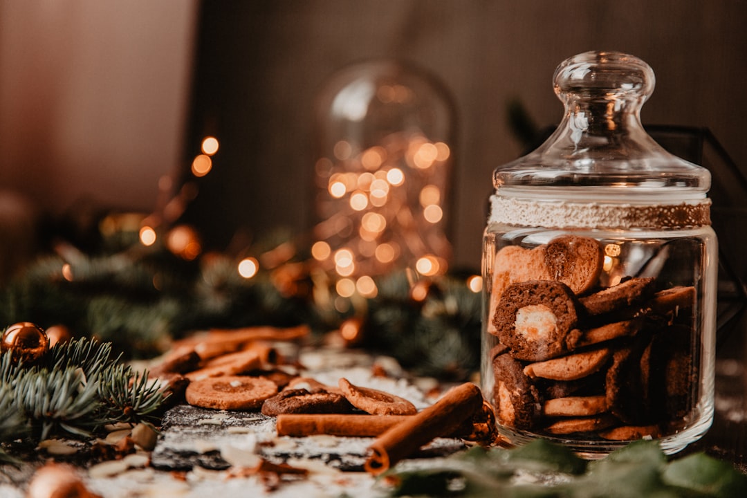 clear glass jar with brown food, Clear Glass Jar With Christmas Cookies on wooden table