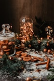 A kitchen counter decorated with cinnamon sticks and homemade cookies for Christmas.