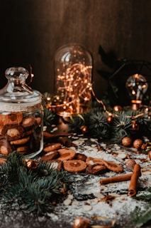 A festive kitchen counter adorned with homemade Christmas cookies and spiced drinks.