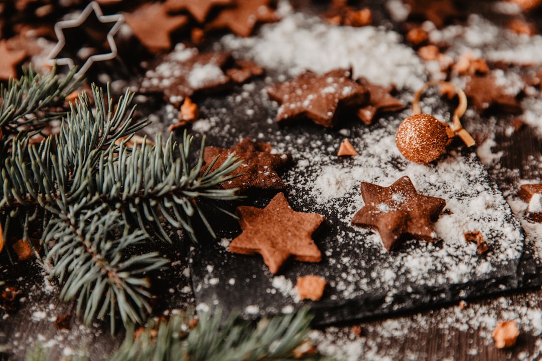 brown star ornament on black surface, Christmas Cookies on wooden table