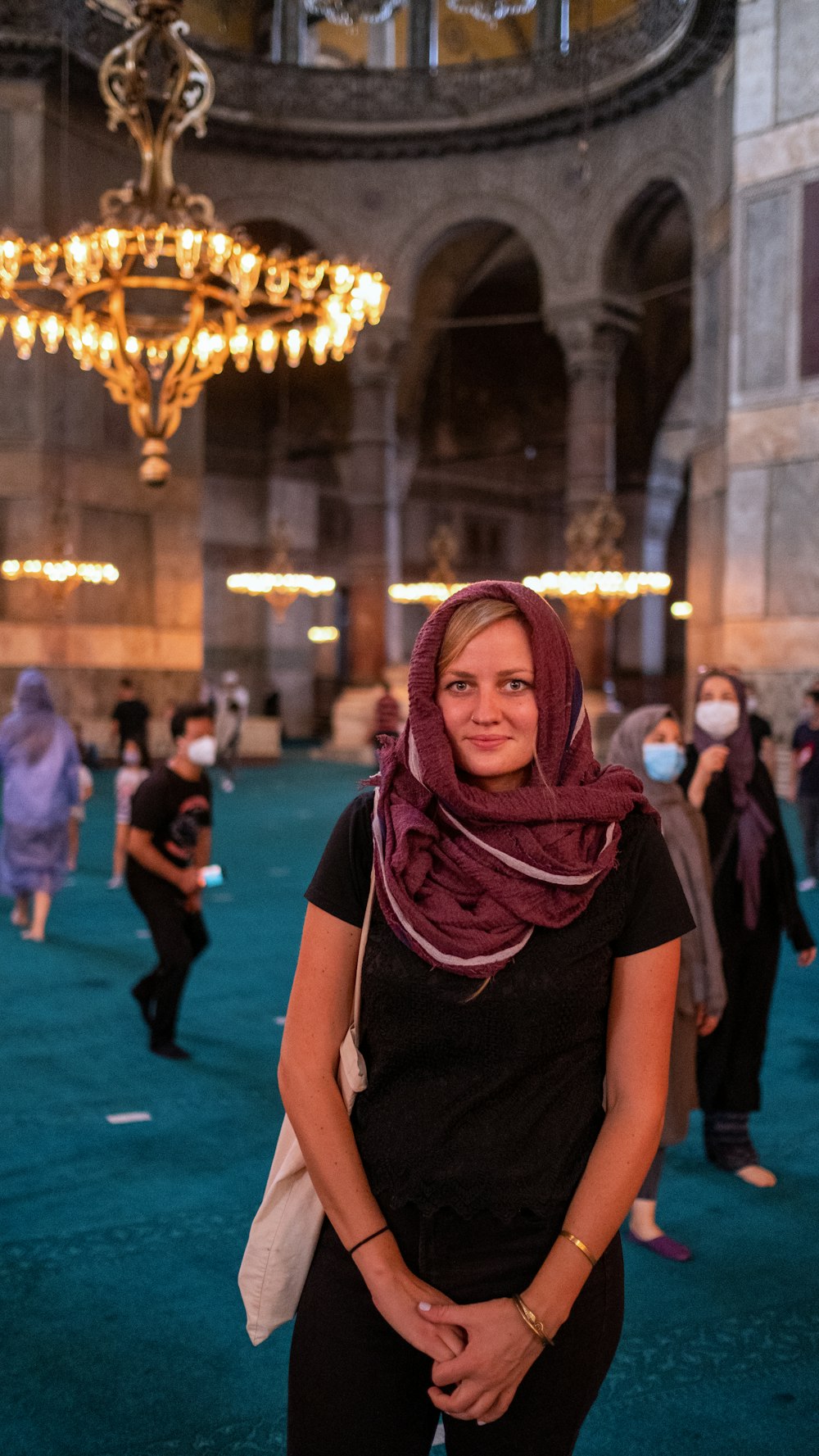 woman in black shirt and purple hijab