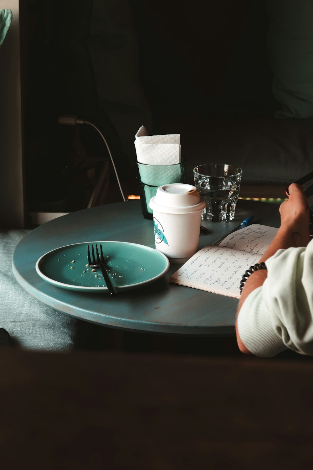 person in white shirt reading book