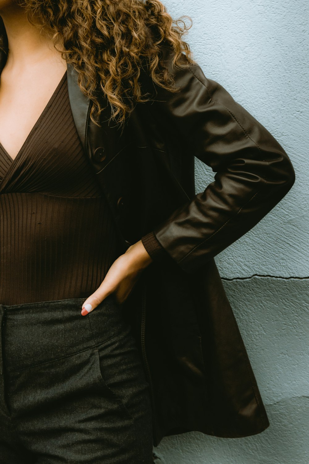 woman in black leather jacket and black skirt